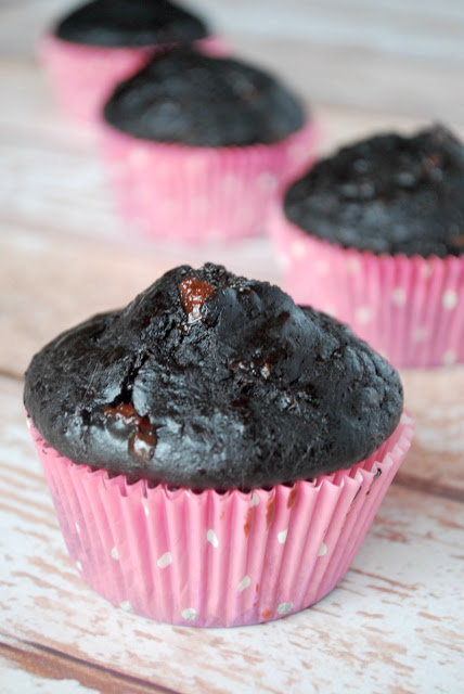 Healthy Double Chocolate Zucchini Muffins double chocolate zucchini muffins in pink paper wrappers