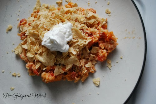 Mexican Casserole - The Gingered Whisk ground turkey mexican casserole topped with crushed chips and sour cream