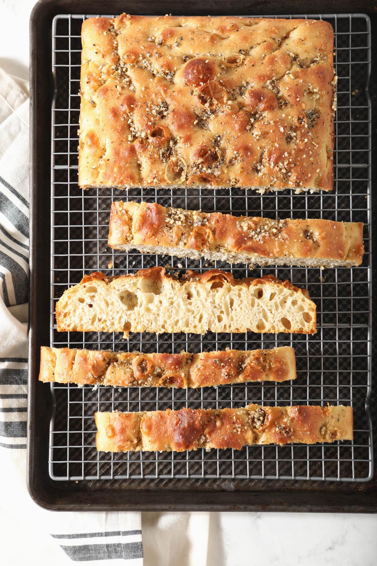 sourdough focaccia slices on cooling rack