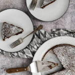 three pieces of Kladdkaka cake on white plates